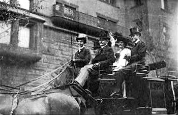 Gladys, in happier days, driving a coach in New York City.