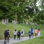 walking group on cemetery path