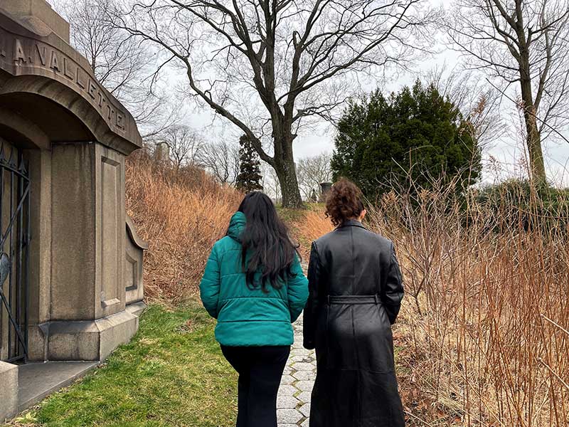 two people walking with their backs to camera